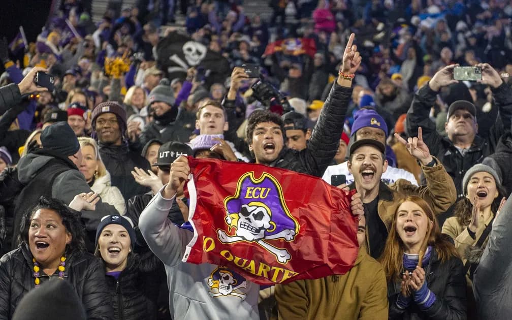 College Football Week 14: Friday Best Bets Incl. Navy vs East Carolina & Nebraska vs Iowa