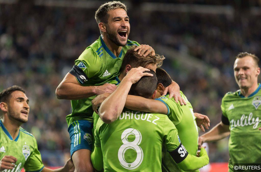 Seattle Sounders players celebrate scoring
