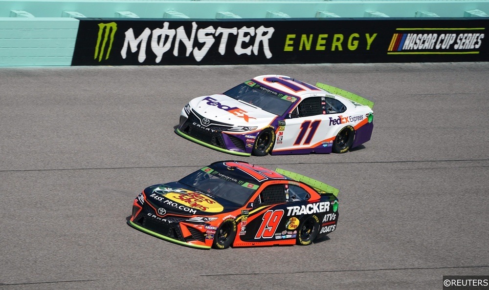 Denny Hamlin and Martin Truex Jr turn laps during practice for Ford EcoBoost 400 at Homsetead-Miami Speedway