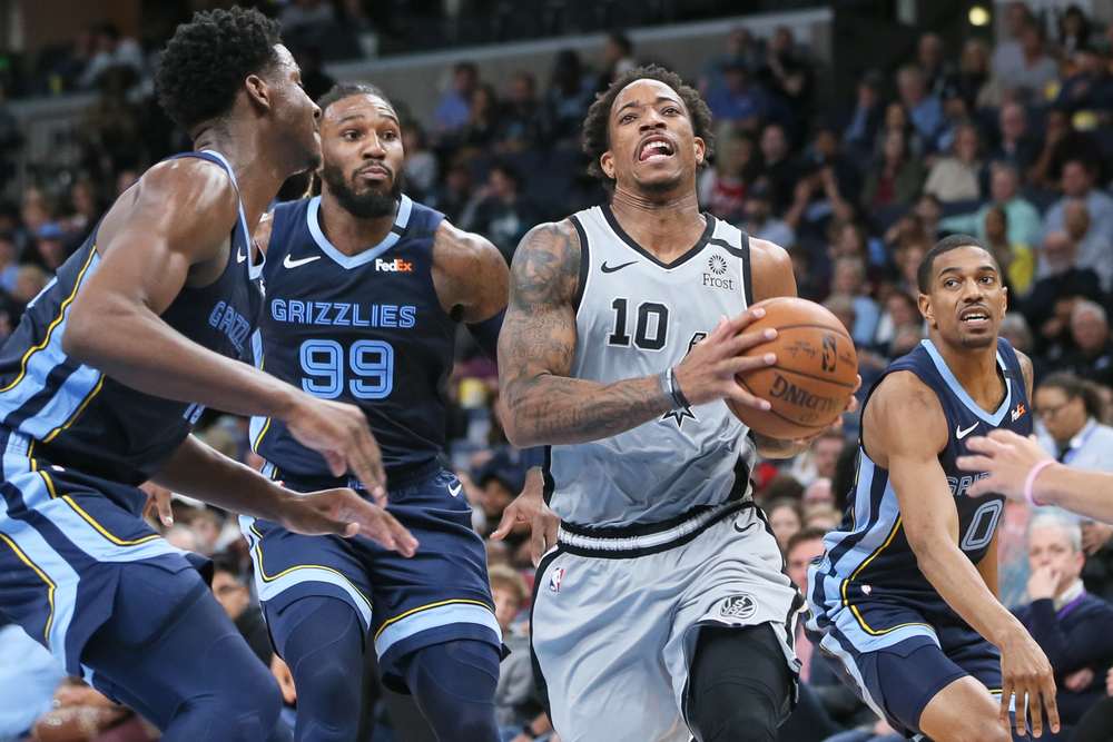 DeMar DeRozan (10) drives to the basket as Memphis Grizzlies forwards Jaren Jackson Jr (13) Jae Crowder (99) and guard De'Anthony Melton