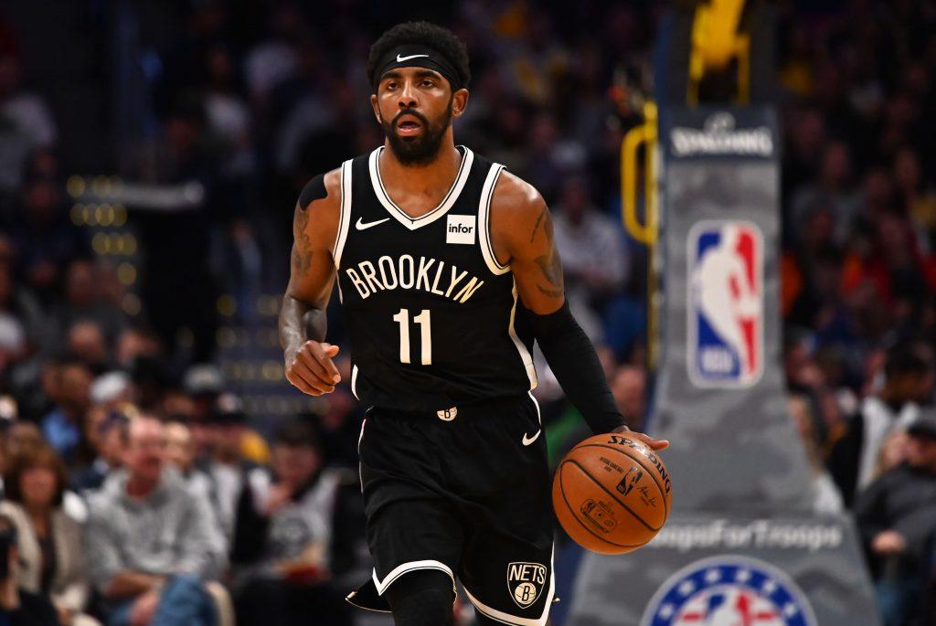 Kyrie Irving of the Brooklyn Nets takes the ball up court.