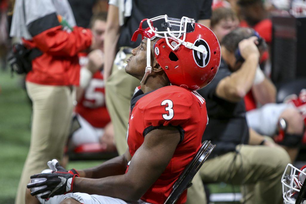 Zamir White resting on the bench during SEC Championship game