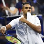 Nick Kyrgios chomps on a towel at the 2019 U.S. Open.