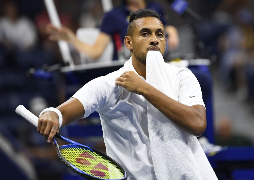 Nick Kyrgios chomps on a towel at the 2019 U.S. Open.