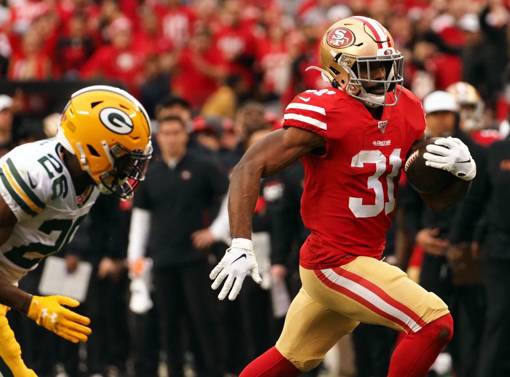Raheem Mostert of the San Francisco 49ers carries the ball in the NFC Championship.