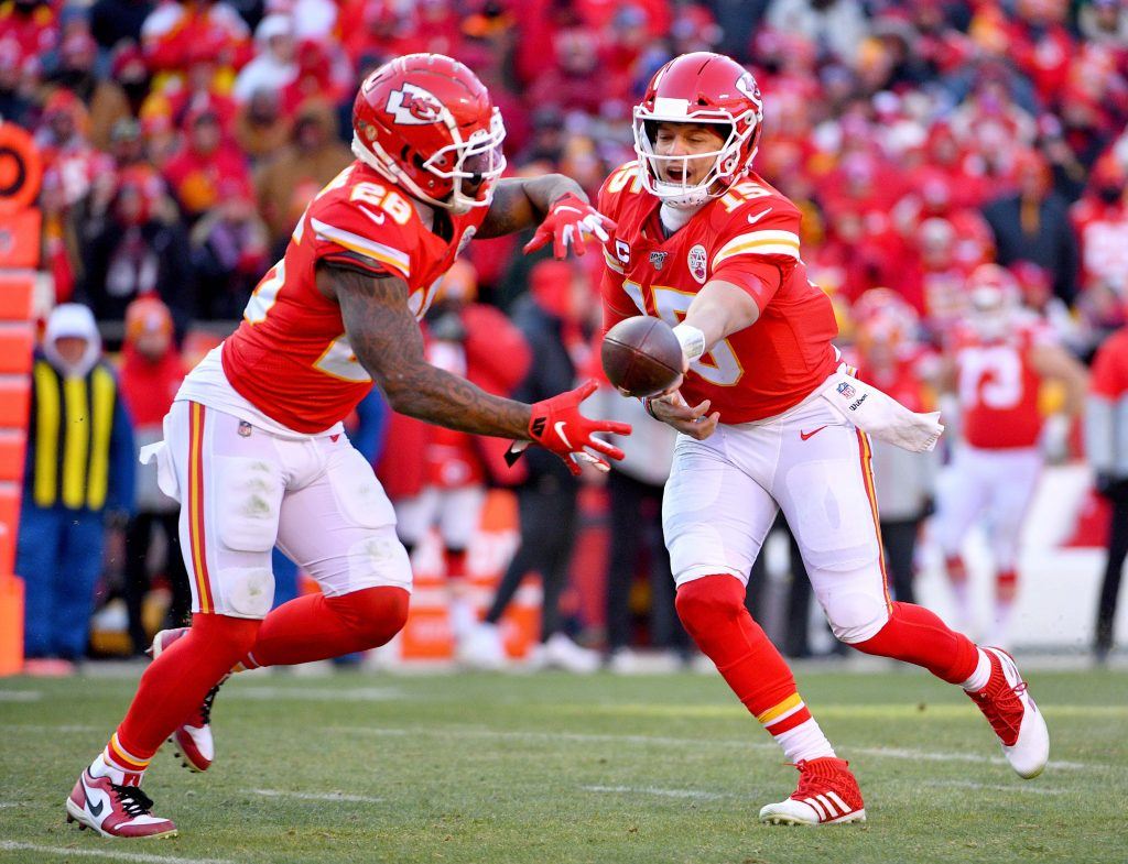Patrick Mahomes of the Kansas City Chiefs hands the ball off to Damien Williams.