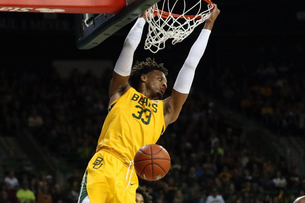 Baylor's Freddie Gillespie hangs on rim after dunking