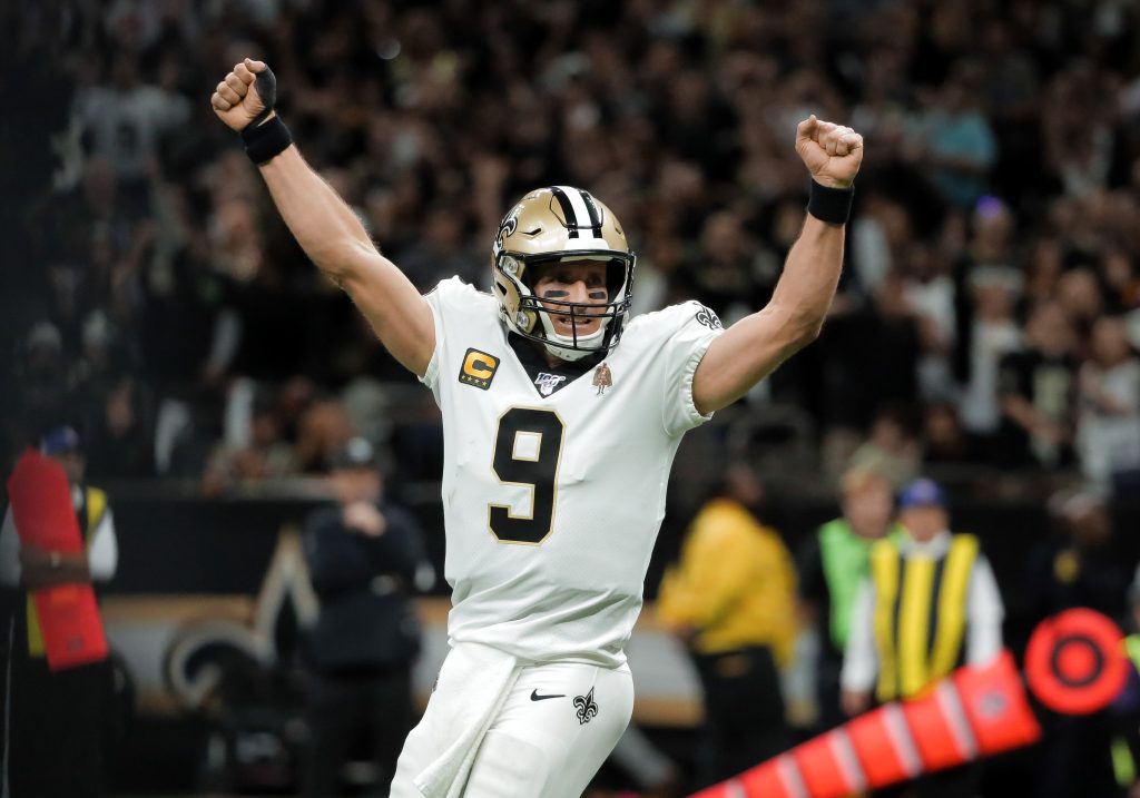 Drew Brees of the New Orleans Saints celebrates a touchdown in the playoffs.
