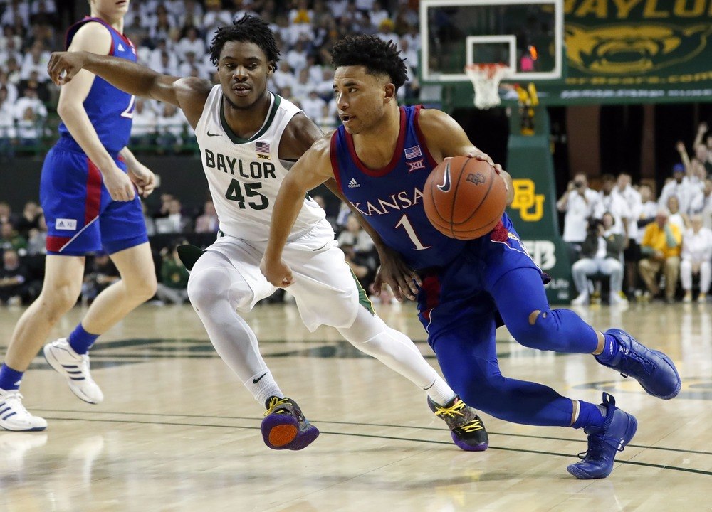 Kansas Jayhawks guard Devon Dotson (1) drives to the basket as Baylor Bears guard Davion Mitchell (45) defends