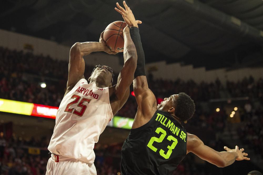Michigan State's Xavier Tillman looks to block Maryland's Jalen Smith shot