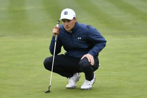 Jordan Spieth lines up a putt at Pebble Beach.