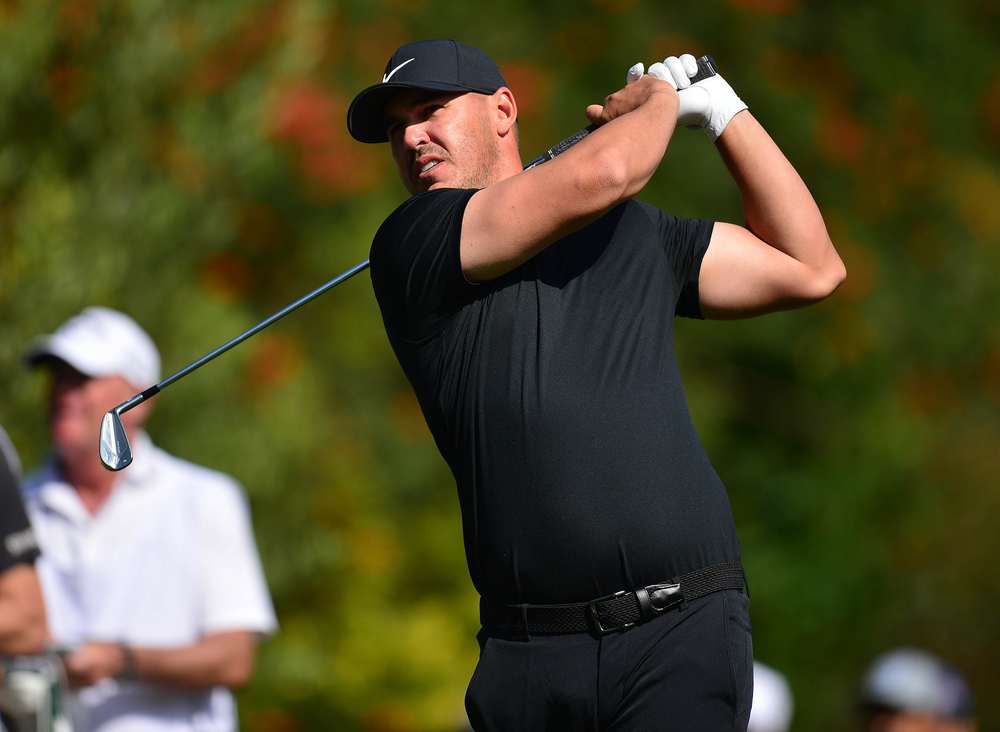 Brooks Koepka hits a shot at Riviera.