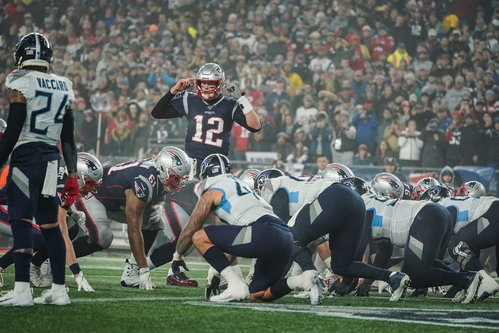 Tom Brady of the New England Patriots calls a play in the playoffs.