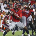 P.J. Walker throwing a football