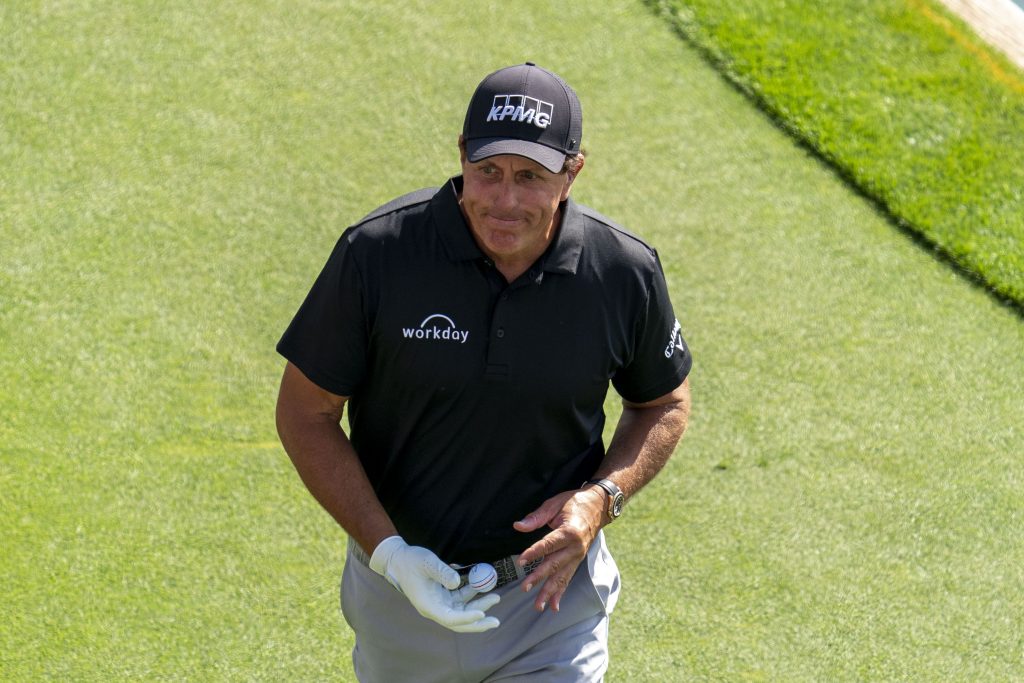 Phil Mickelson walks off a green at The Players Championship.