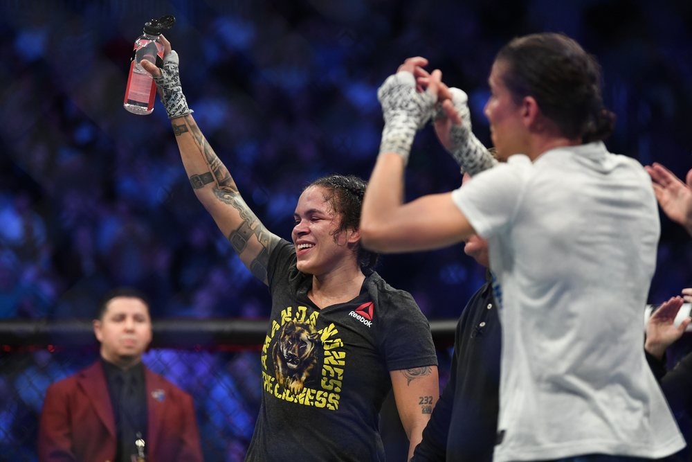 Amanda Nunes (left) reacts after defeating Germaine de Randamie (right) during UFC 245