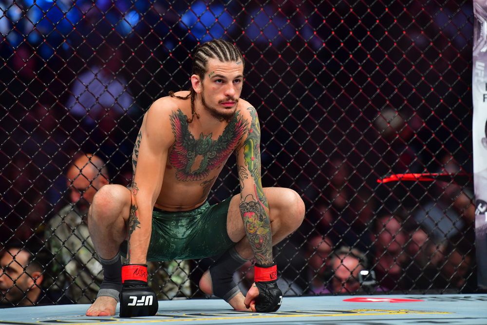 Sean O'malley (red gloves) fights Jose Quinonez (blue gloves) during UFC 248 at T-Mobile Arena.