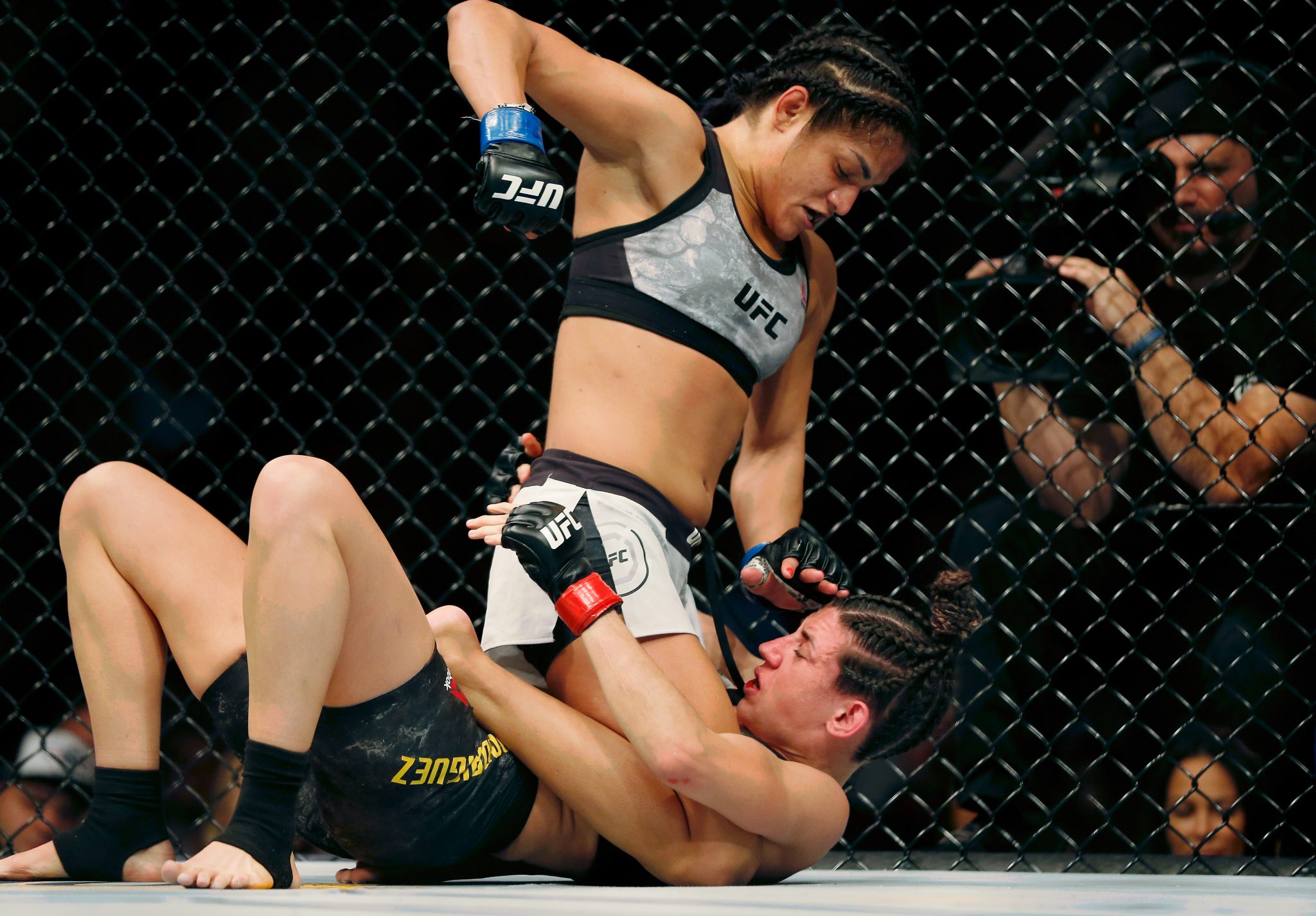 Marina Rodriguez (red gloves) fights Cynthia Calvillo (blue gloves) during ...