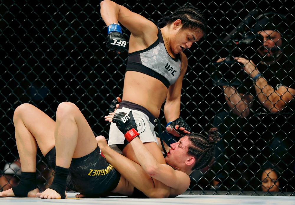 Marina Rodriguez (red gloves) fights Cynthia Calvillo (blue gloves) during UFC Fight Night at Capital One Arena.