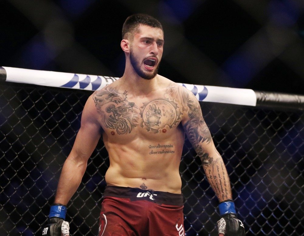 Charles Jourdain (blue gloves) defeats Dooho Choi (red gloves) during UFC Fight Night at Sajik Arena.