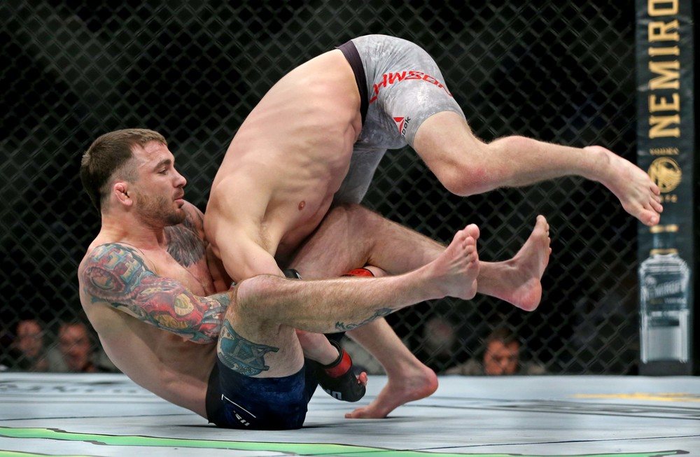 Grant Dawson (red gloves) fights Darrick Minner (blue gloves) during UFC Fight Night at Chartway Arena.