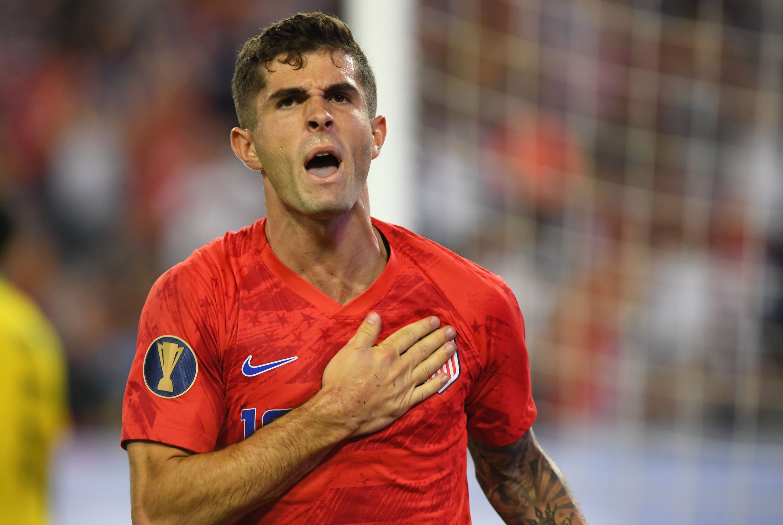 Christian Pulisic (10) celebrates after a goal against Jamaica