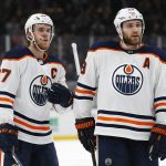 Edmonton Oilers center Connor McDavid (97) and center Leon Draisaitl (29)