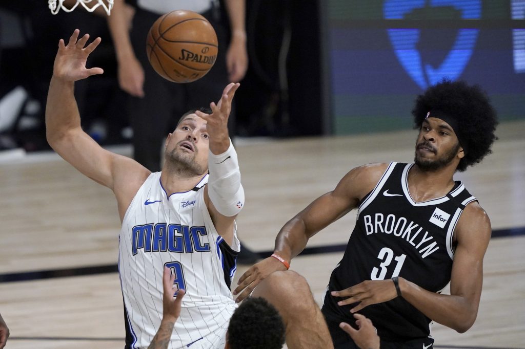 Nikola Vucevic of the Orlando Magic grabs a rebound