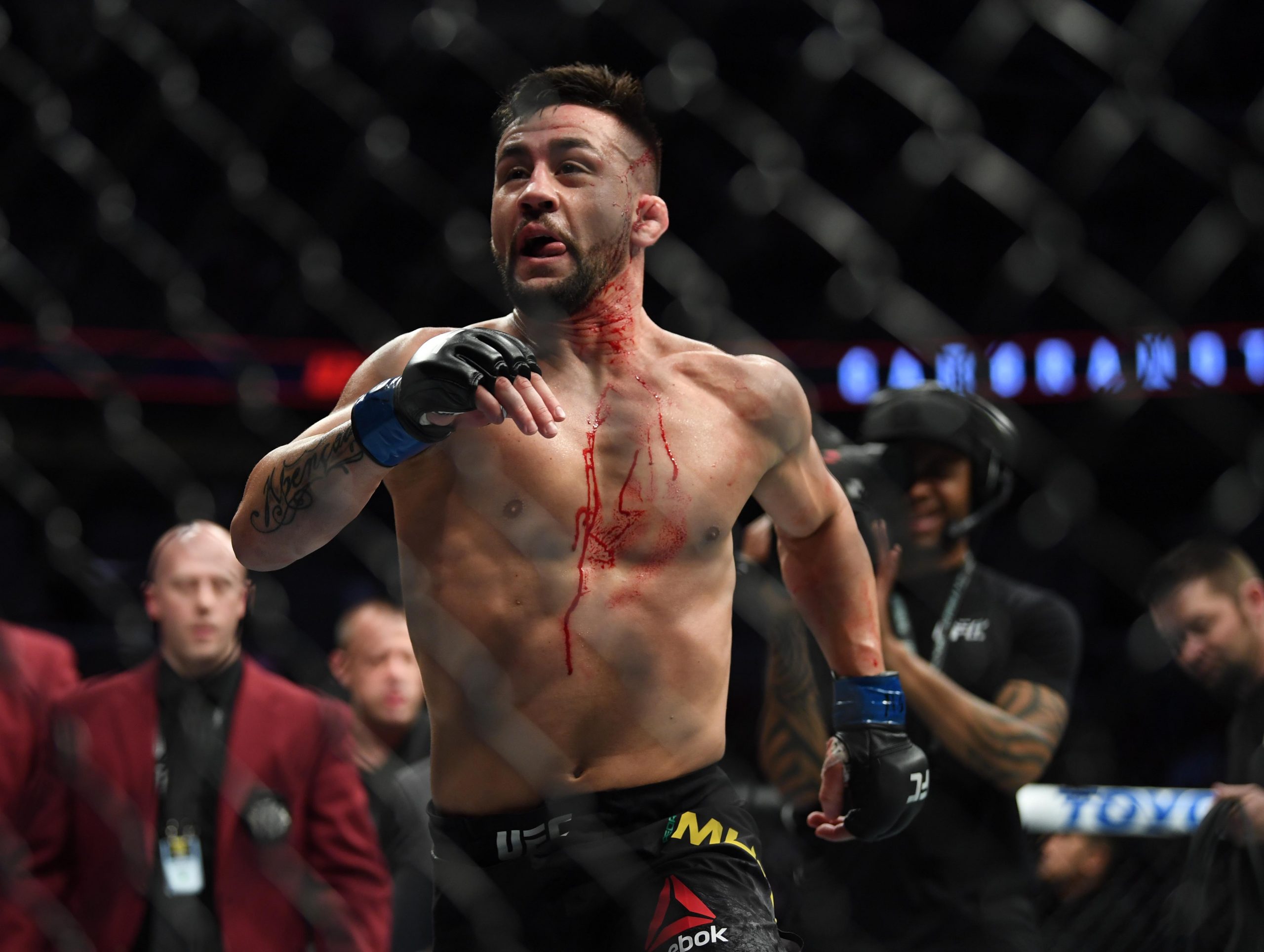 Mar 2, 2019; Las Vegas, NV, USA; Pedro Munhoz (blue gloves) and Cody Garbrandt (red gloves) during UFC 235 at T-Mobile Arena.