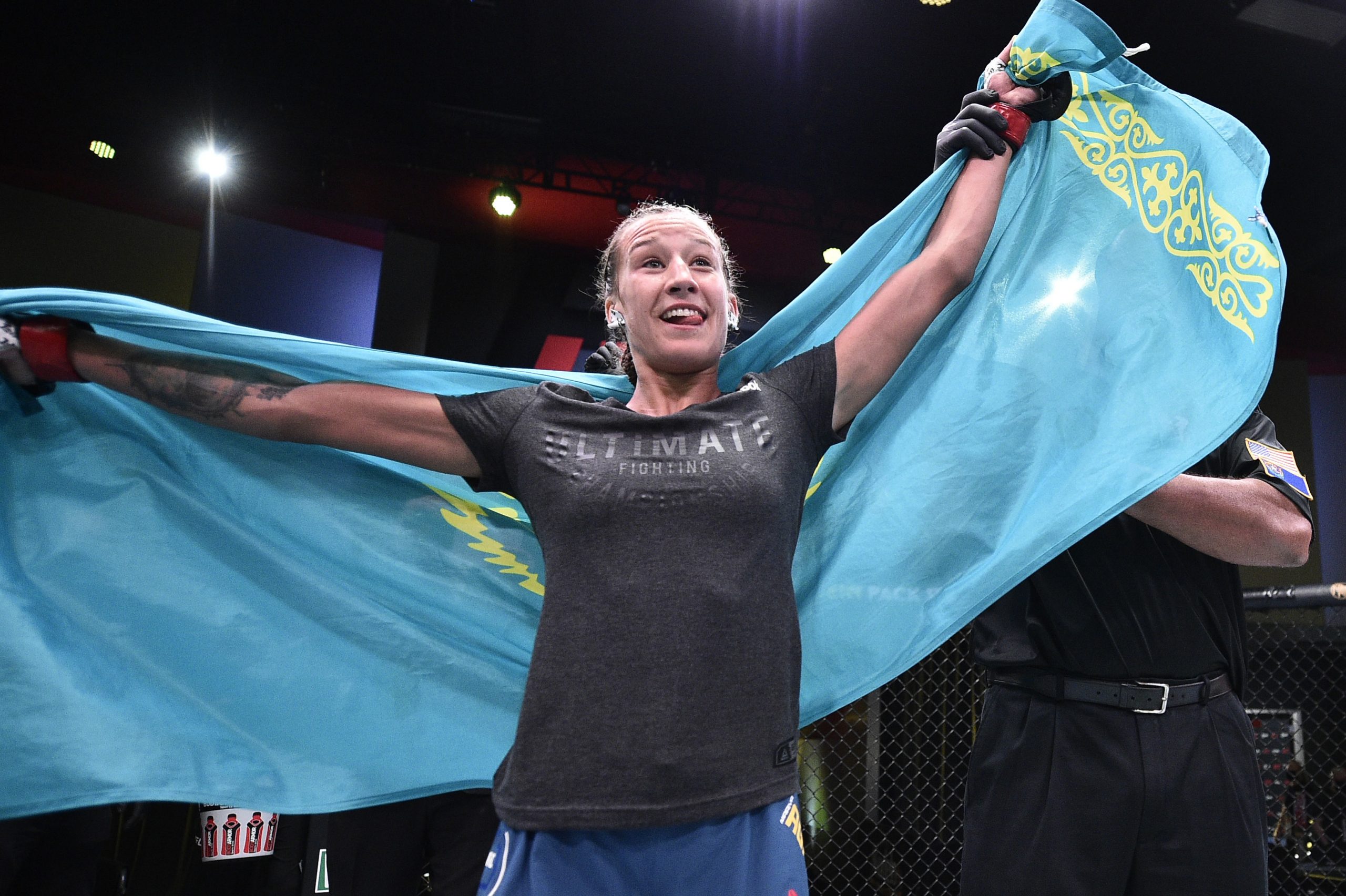 June 13, 2020; Las Vegas, NV, USA; Mariya Agapova (red gloves) celebrates after her victory over Hannah Cifers in their flyweight fight during UFC Fight Night at the UFC APEX.