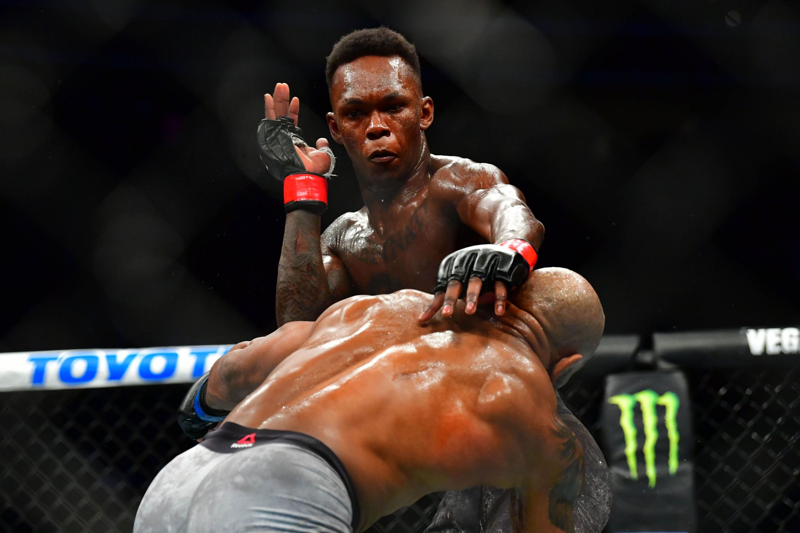 UFC fighter Israel Adesanya, pictured here taking on Yoel Romero, will fight Paulo Costa at UFC 253