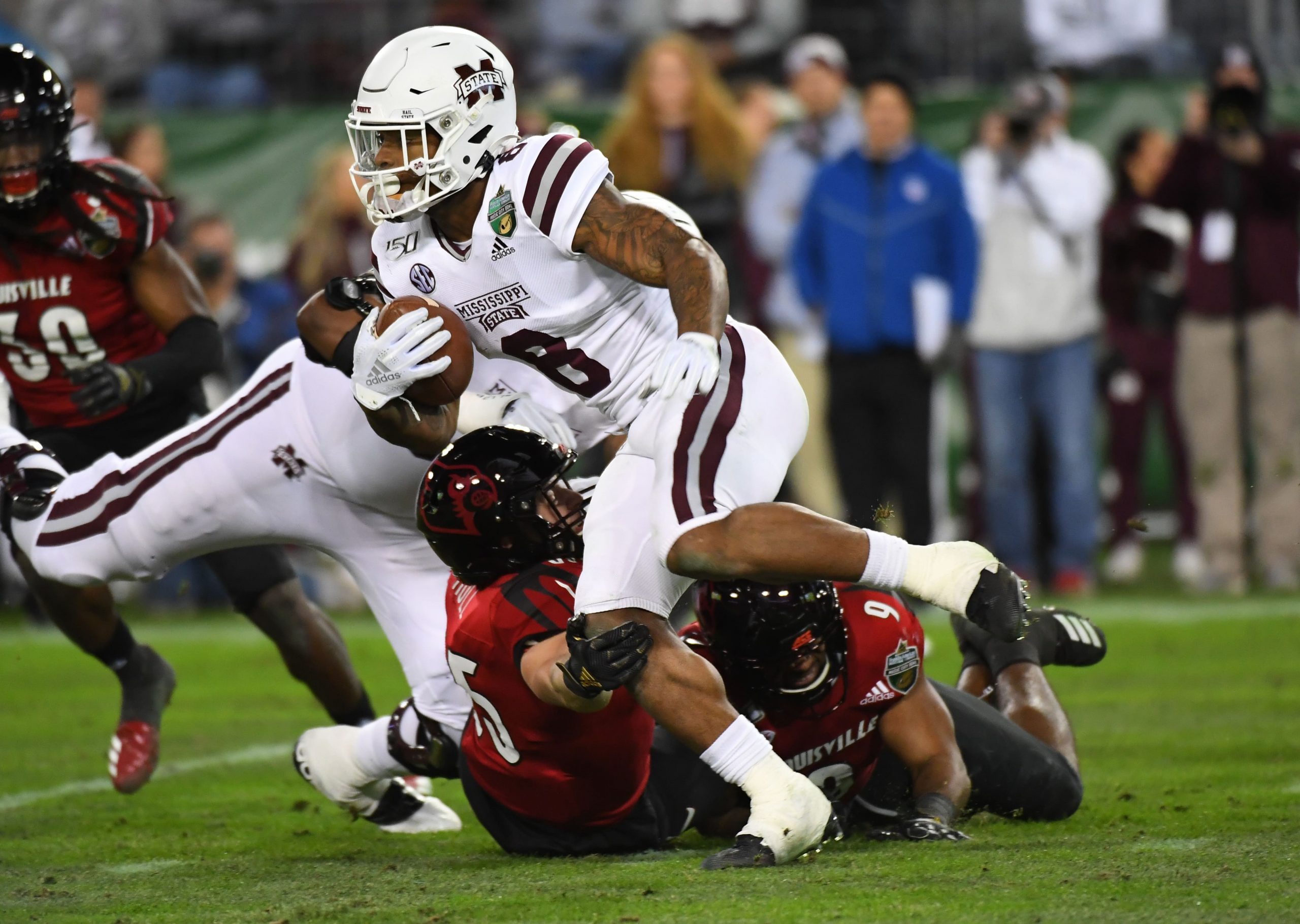 Mississippi State Bulldogs runningback Kylin Hill carries the ball against the Louisville Cardinals