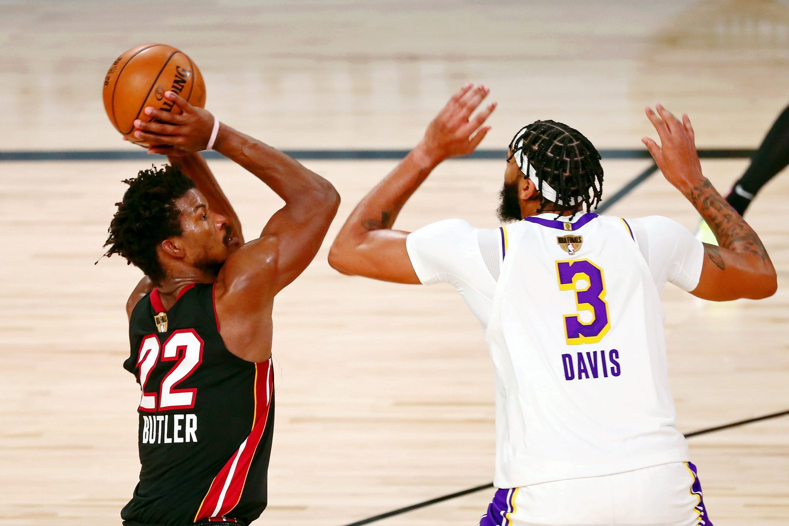 Miami Heat forward Jimmy Butler shoots against Los Angeles Lakers forward Anthony Davis (3) during the fourth quarter of game three of the 2020 NBA Finals at AdventHealth Arena.