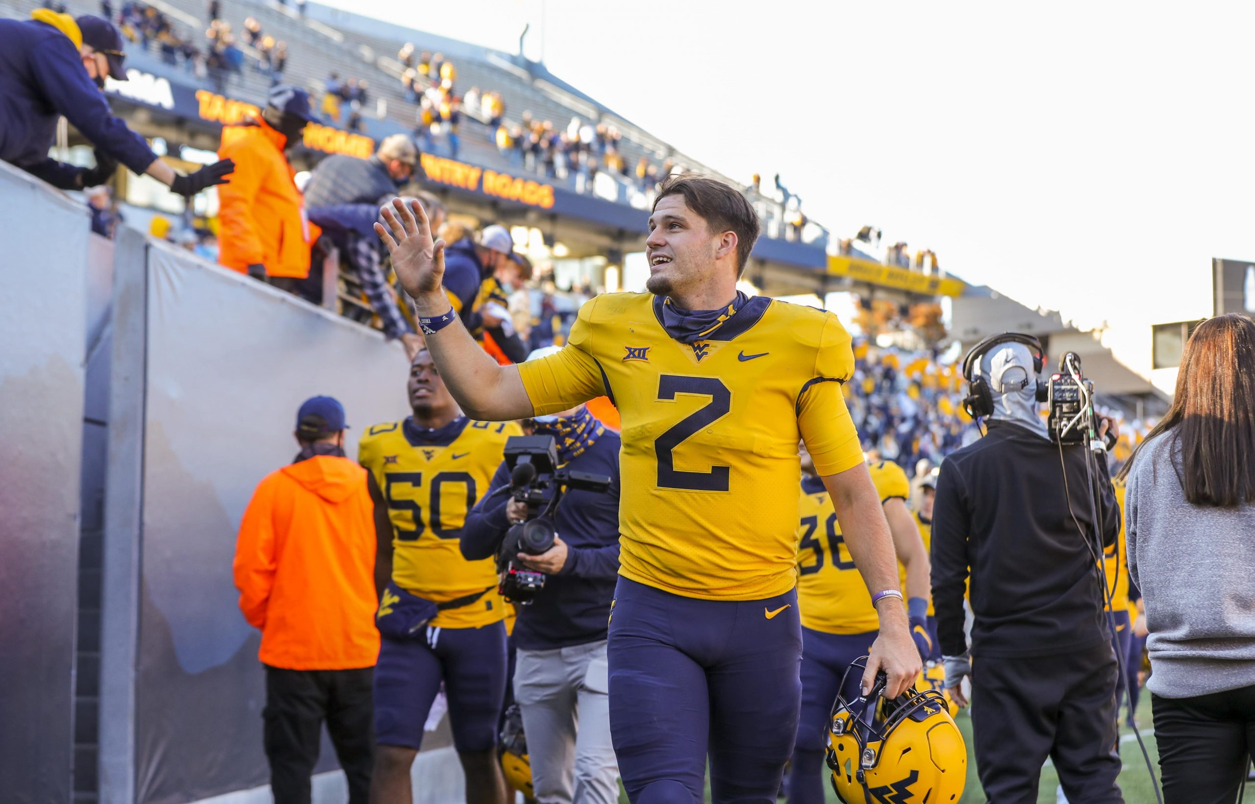 West Virginia quarterback Jarret Doege leaves the field after win over Kansas State Wildcats