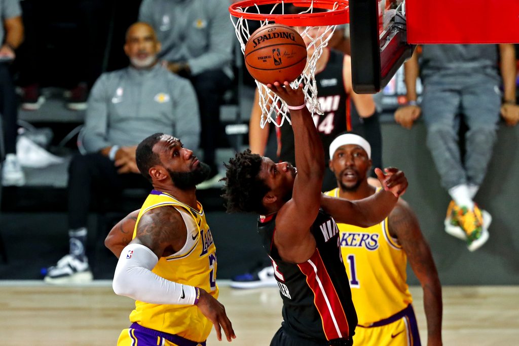 Miami Heat forward Jimmy Butler shoots the ball against Los Angeles Lakers forward LeBron James during the fourth quarter in Game 4 of the 2020 NBA Finals at AdventHealth Arena.