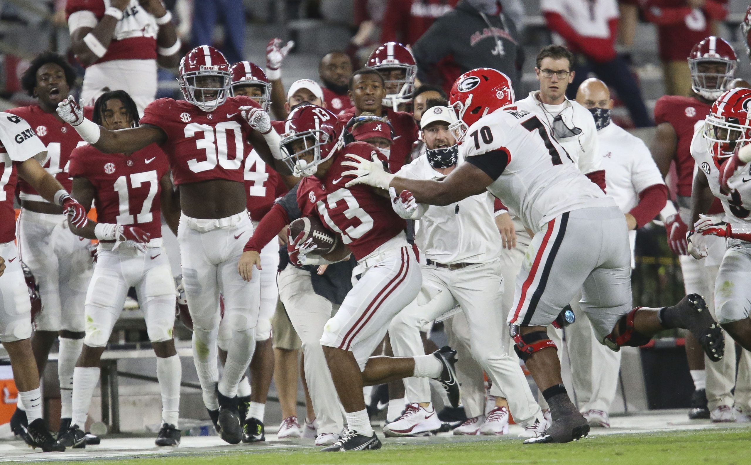 Oct 17, 2020; Tuscaloosa, Alabama, USA; Georgia offensive lineman Warren McClendon (70) forces Alabama defensive back Malachi Moore (13) out of bounds after Moore intercepted a pass during the second half of Alabama's 41-24 win over Georgia at Bryant-Denny Stadium.