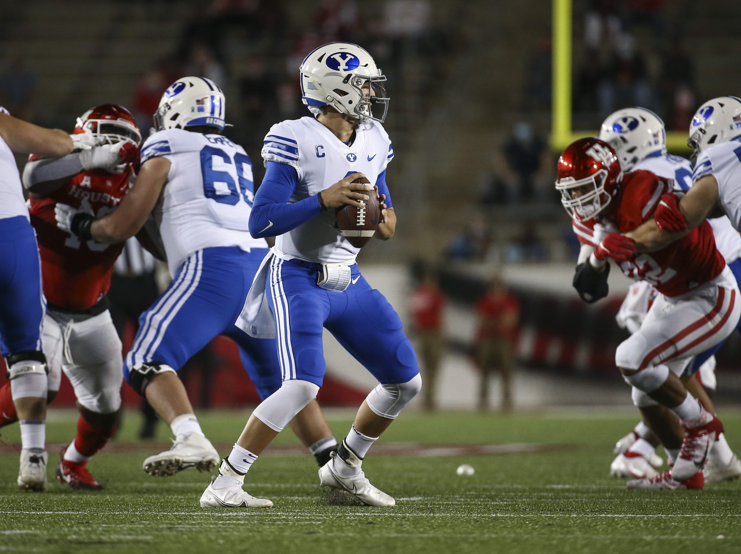 Oct 16, 2020; Houston, Texas, USA; Brigham Young Cougars quarterback Zach Wilson (1) looks for an open receiver during the first quarter against the Houston Cougars at TDECU Stadium.