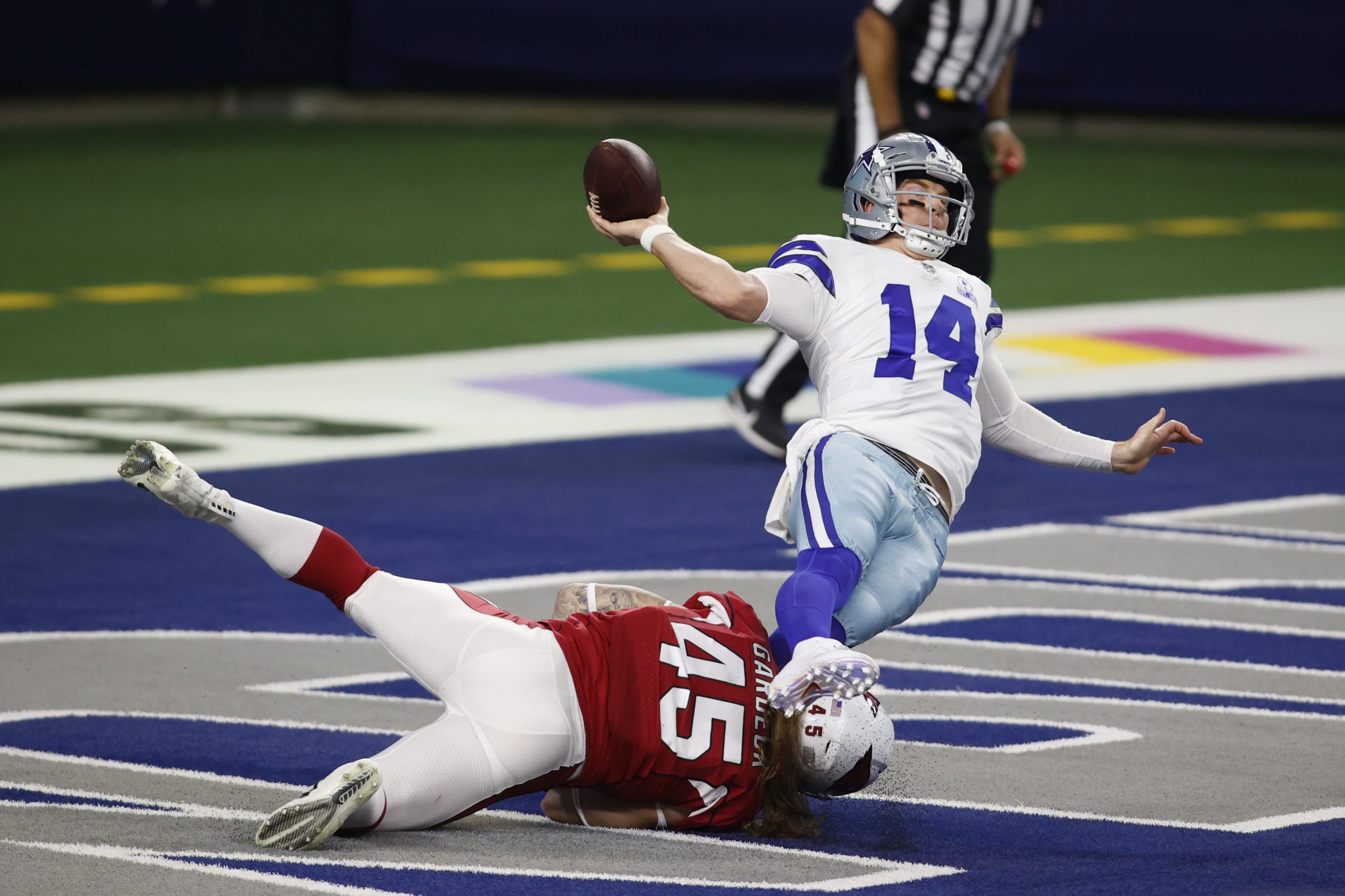 Dallas Cowboys quarterback Andy Dalton is tackled in loss to Arizona Cardinals
