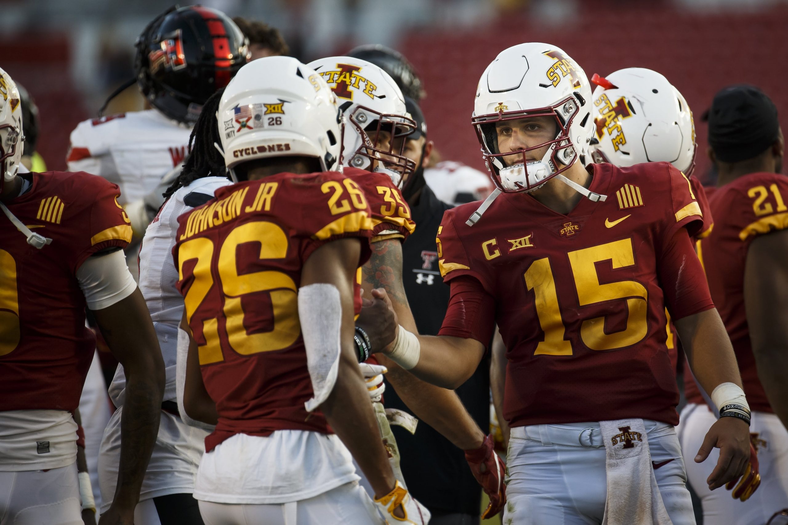 Iowa State quarterback Brock Purdy celebrates with teammate