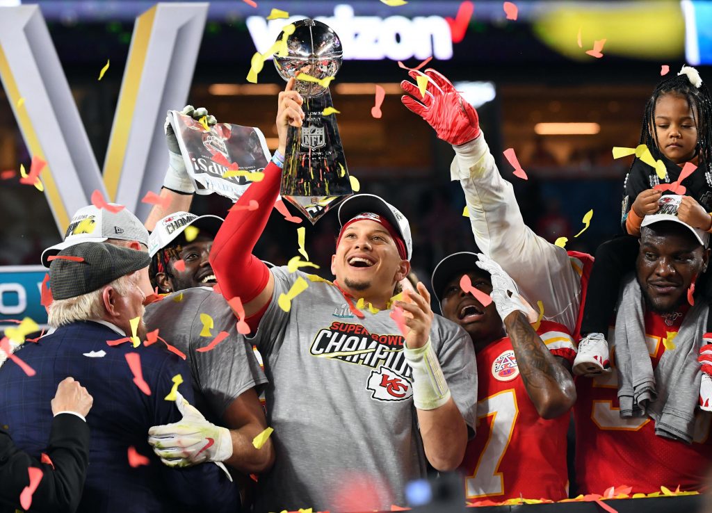 Kansas City Chiefs quarterback Patrick Mahomes (15) hoist the Vince Lombardi Trophy after defeating the San Francisco 49ers in Super Bowl LIV at Hard Rock Stadium.