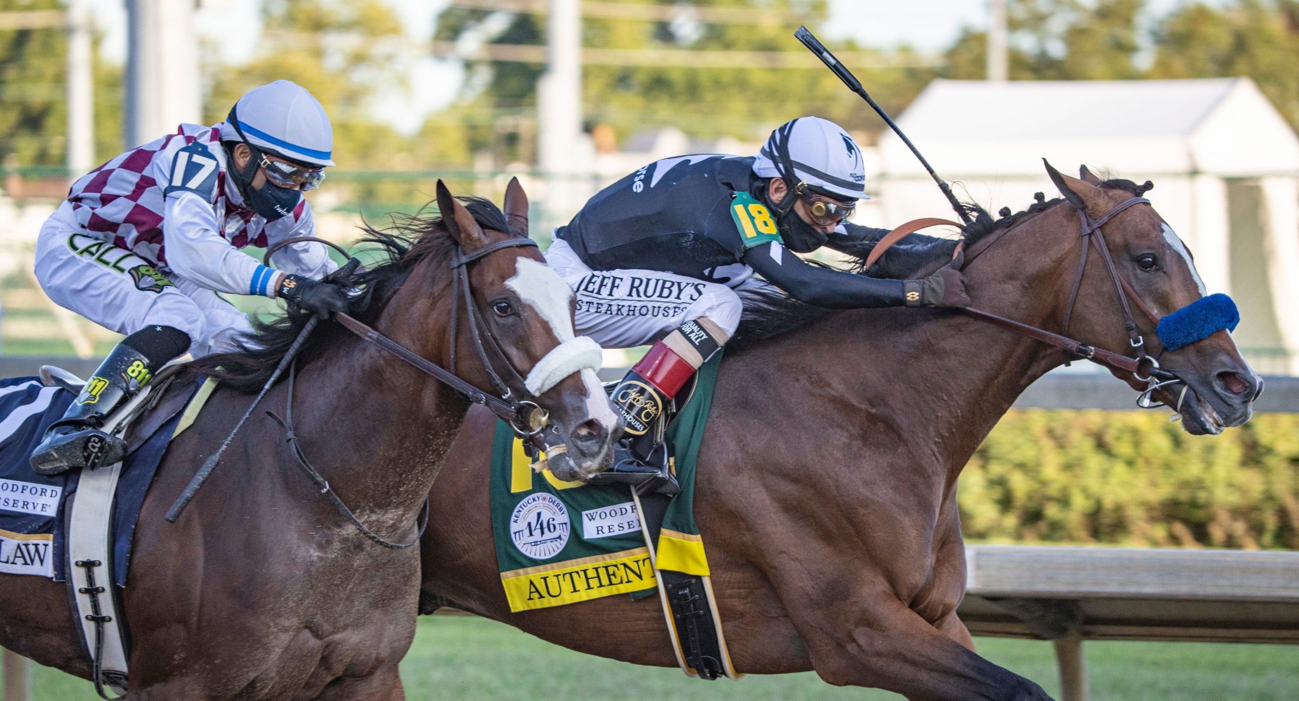 Tiz the Law, left, ridden by jockey Manuel Franco and Authentic, ridden by jockey John Velazquez, lead the field as they come out of the final turn during the running of the 146th Kentucky Derby.