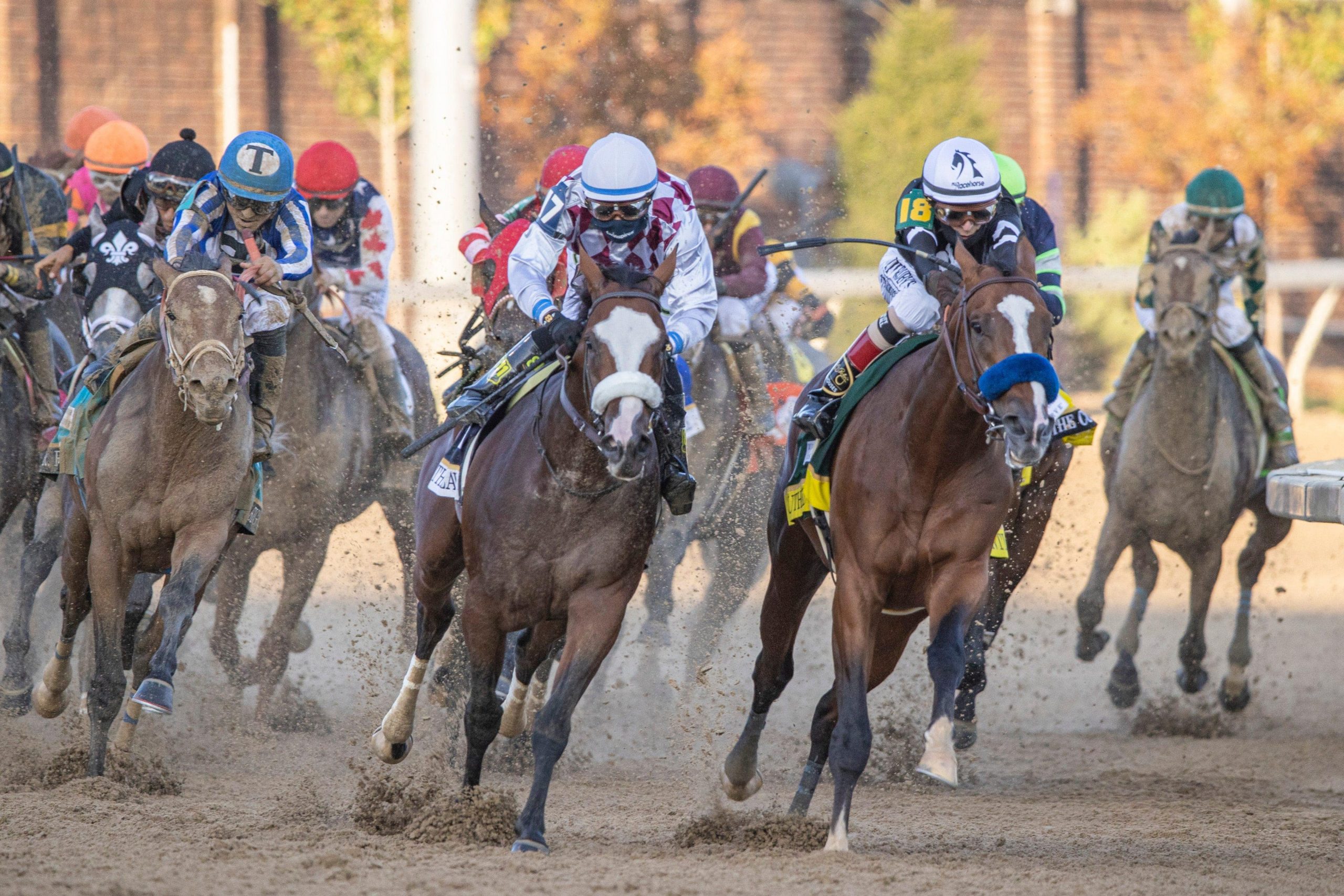 Tiz the Law, center left, ridden by jockey Manuel Franco and Authentic, center right, ridden by jockey John Velazquez, lead the field as they come out of the final turn during the running of the 146th Kentucky Derby.