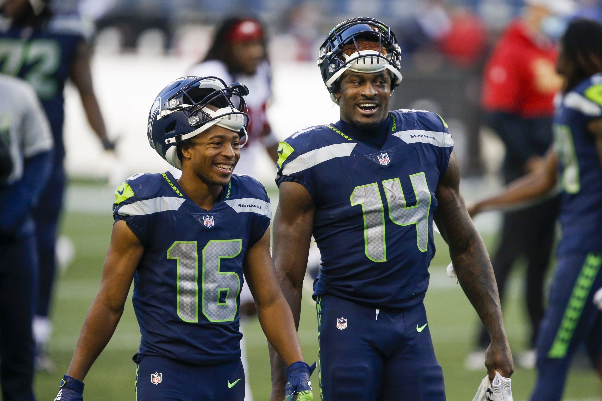 Seattle Seahawks wide receiver Tyler Lockett (16) and wide receiver DK Metcalf (14) return to the locker room following a 37-27 victory against the San Francisco 49ers at CenturyLink Field.