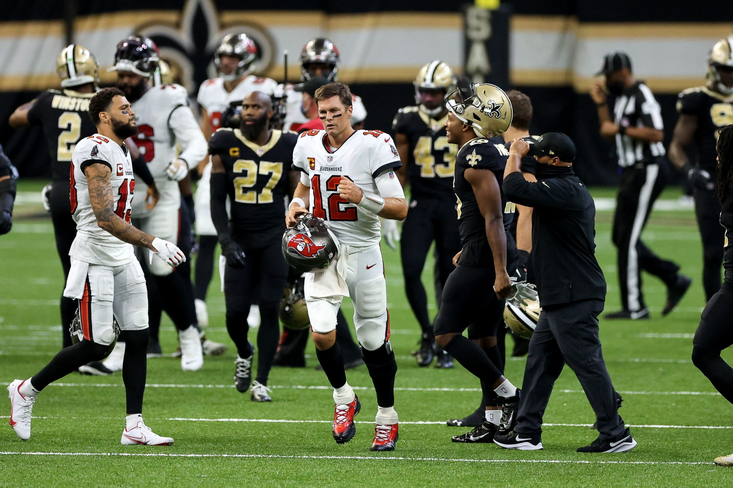 Tampa Bay Buccaneers quarterback Tom Brady jogs off field after loss to New Orleans Saints