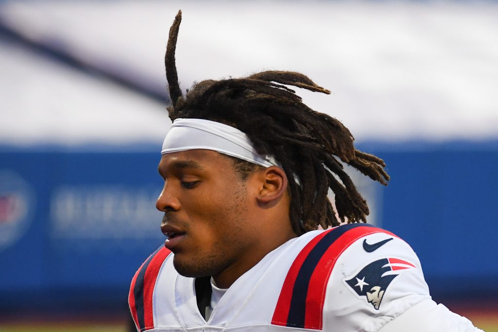 New England Patriots quarterback Cam Newton leaves the field following loss to Buffalo Bills