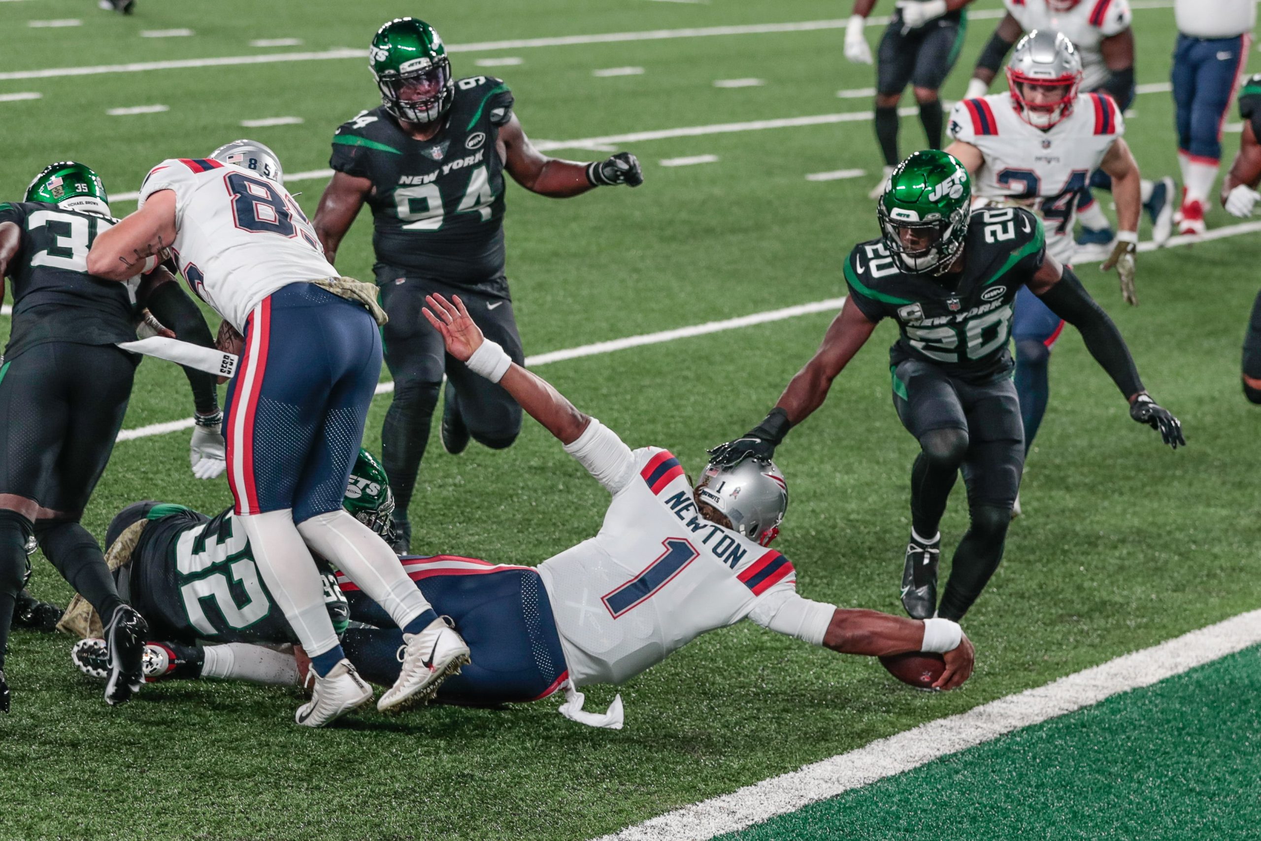 New England Patriots quarterback Cam Newton reaches for the endzone during win over the New York Jets on Monday Night Football