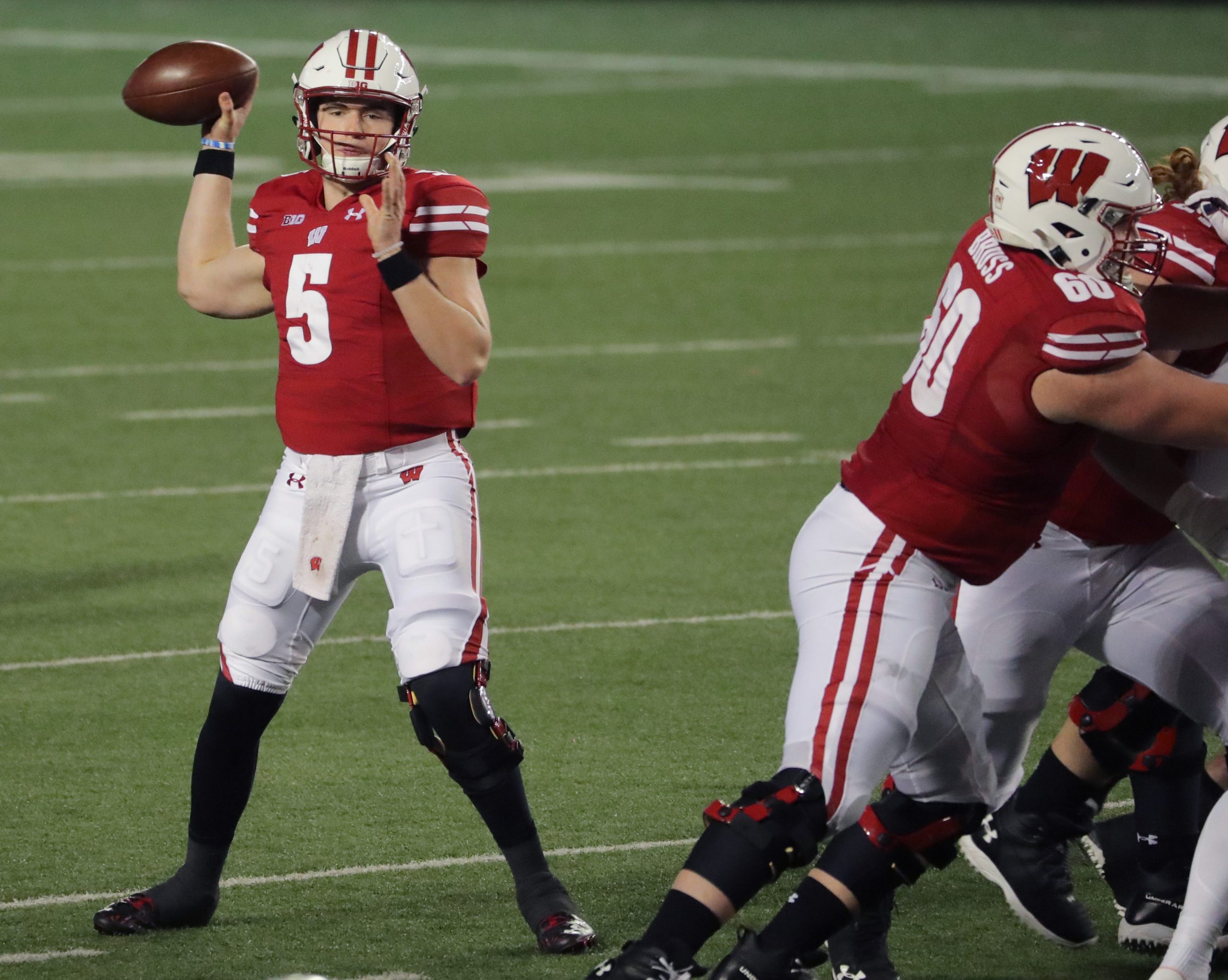Wisconsin Badgers quarterback Graham Mertz drops back to pass during win over Illinois