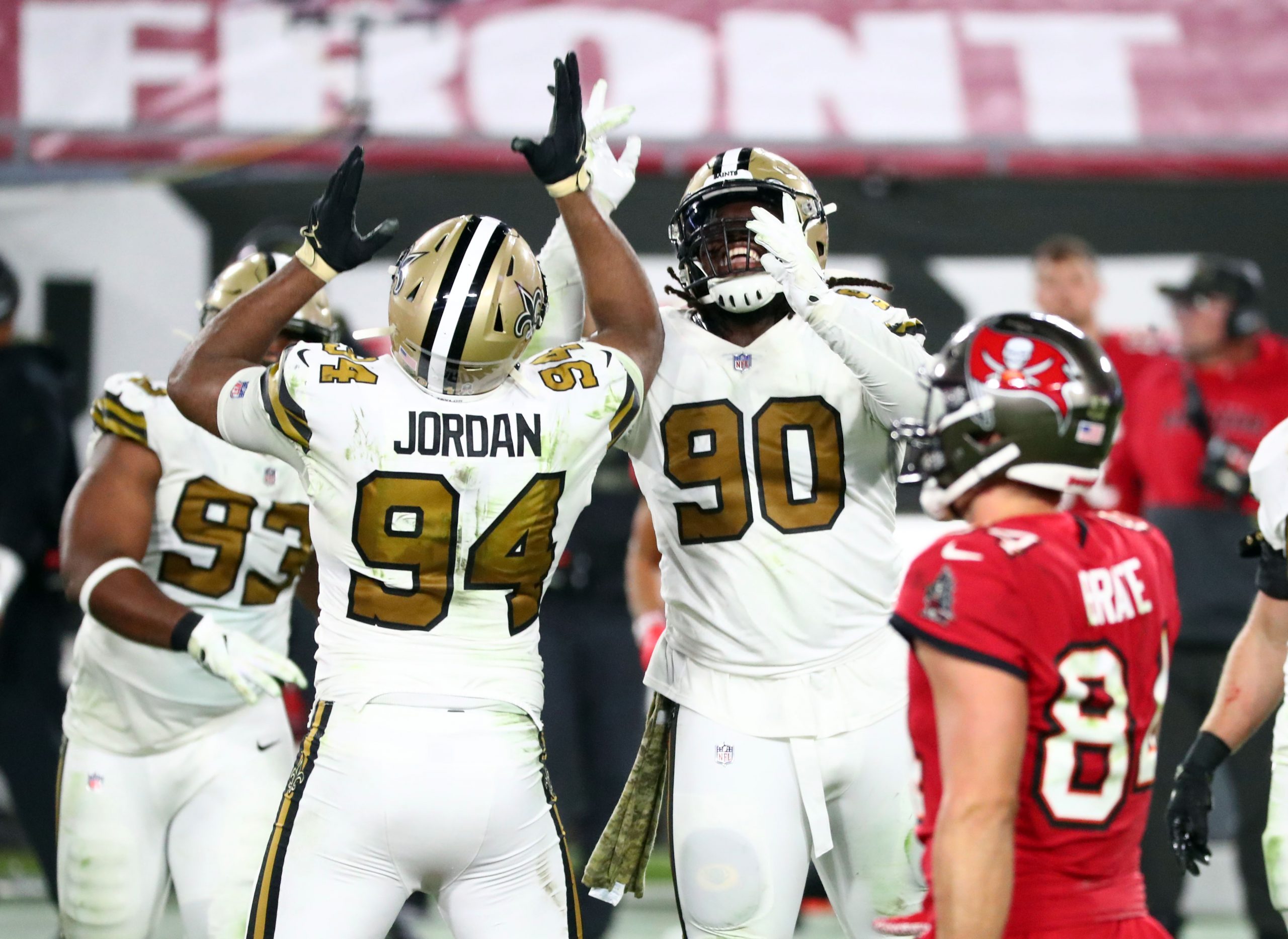 New Orleans Saints defensive tackle Malcom Brown (90) celebrates with defensive end Cameron Jordan (94) as he sacks Tampa Bay Buccaneers quarterback Tom Brady (12).