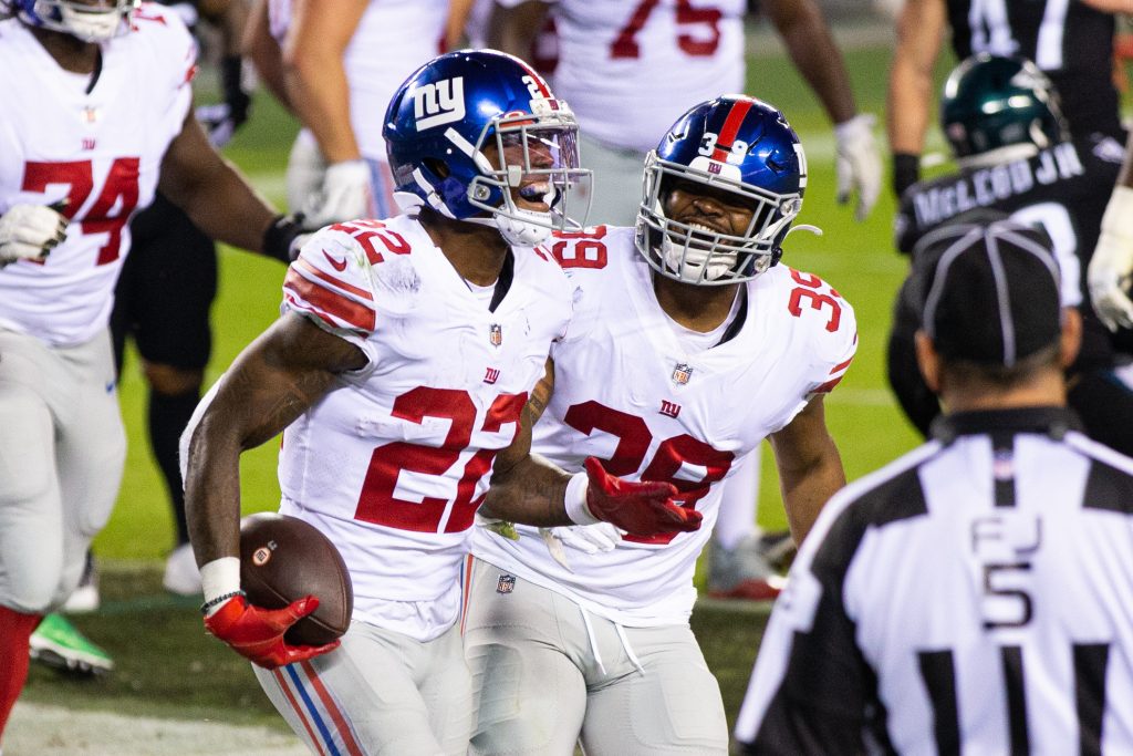 New York Giants running back Wayne Gallman (22) celebrates his touchdown run with running back Elijhaa Penny (39) during the third quarter against the Philadelphia Eagles at Lincoln Financial Field.