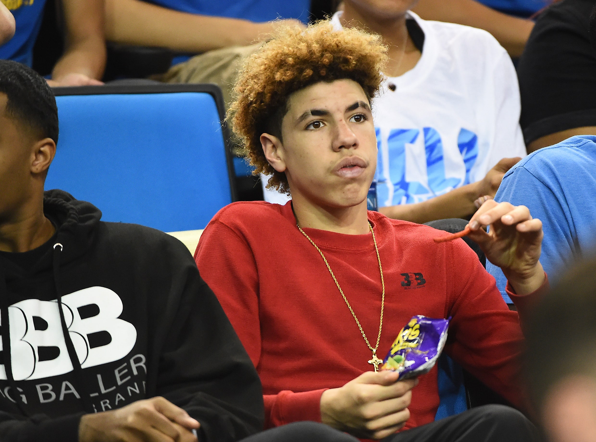 LaMelo Ball sits in the stands